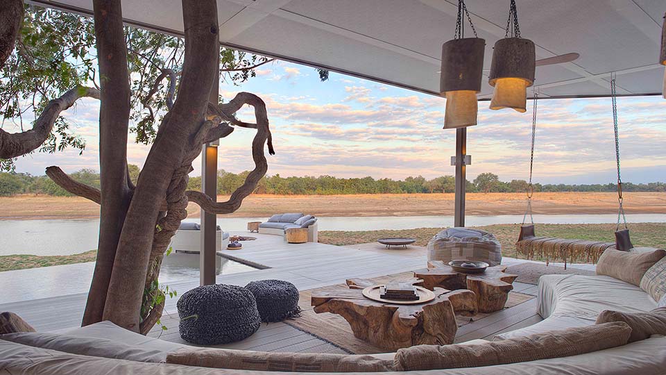Watch the game from the lounge at Time + Tide Chinzombo, South Luangwa, Zambia