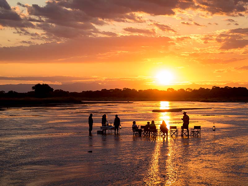 Sundowners in the river, Zambian, Africa