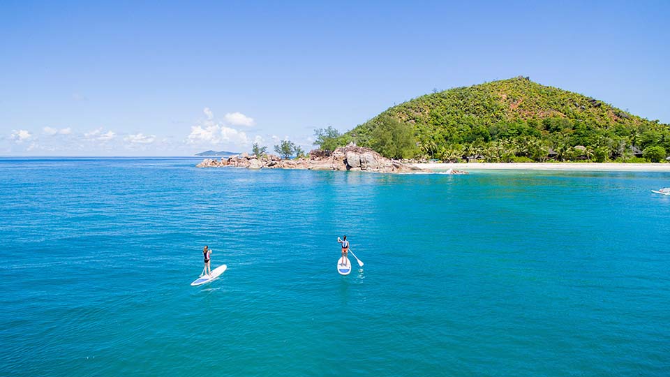 Stand up Paddle boarding in the stunning waters of Lemuria, Seychelles
