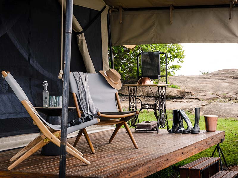 Relax on the deck of your safari tent at Sanctuary Kichakani Cap Serengeti Tanzania